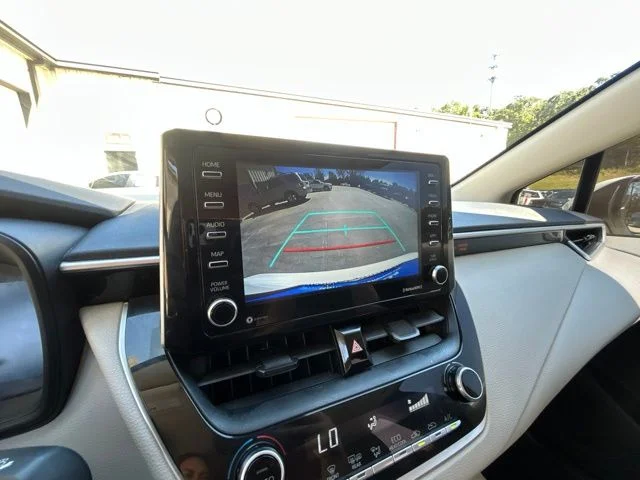 Used 2021 Super White Toyota LE image 24