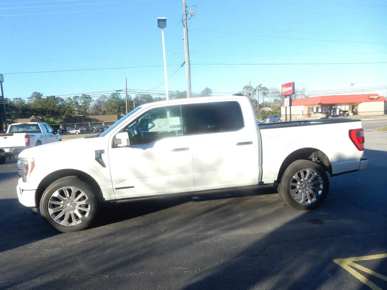 New 2023 Pearl White Ford LIMITED 4WD SUPERCREW 5.5 image 5