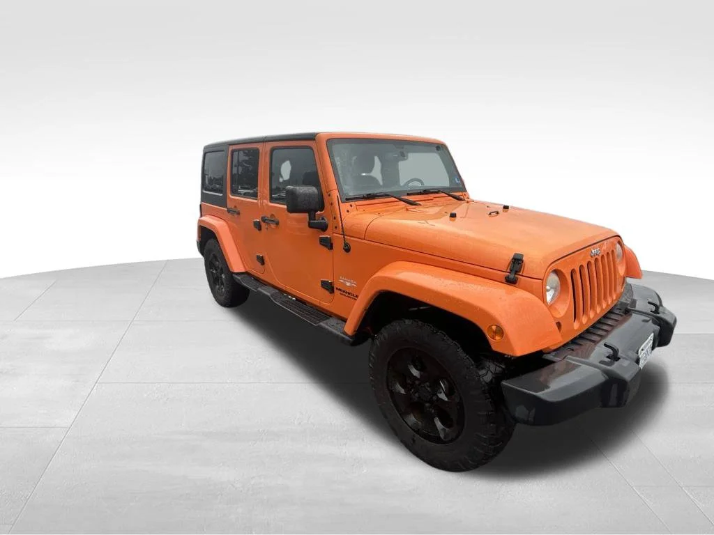 Used 2013 Orange Jeep Unlimited Sahara image 21
