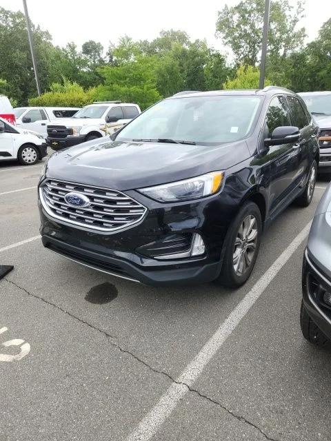 Used 2023 Black Ford Titanium image 1