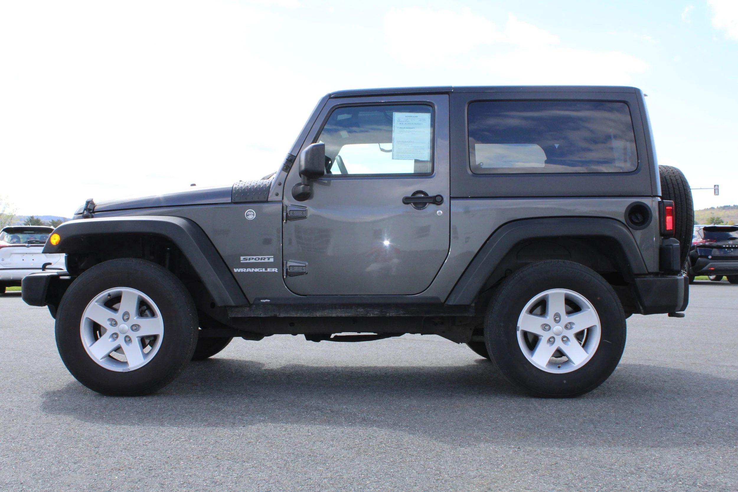 Used 2017 Granite Crystal Metallic Clearcoat Jeep Sport image 3