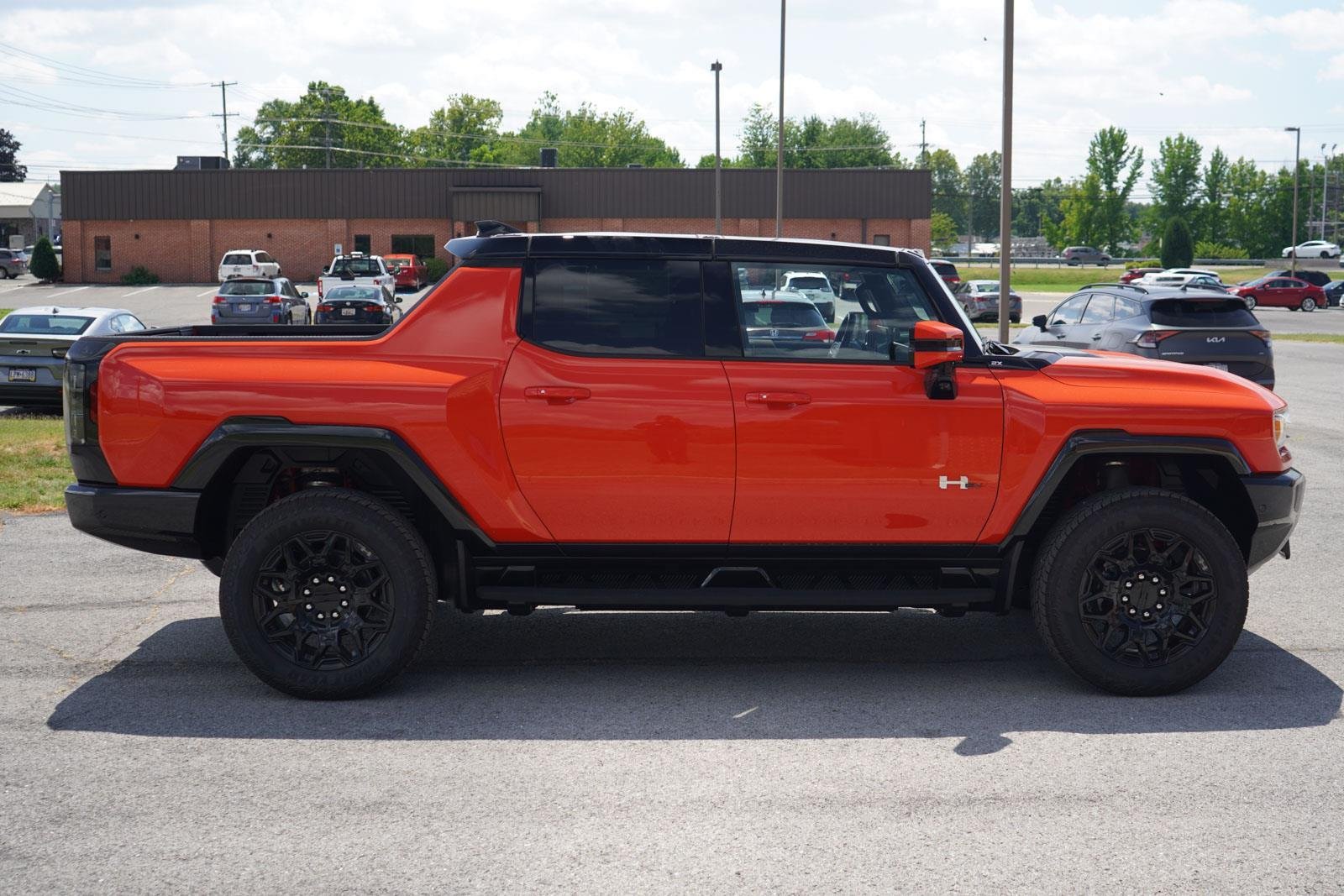 New 2025 Solar Orange GMC 2X image 2