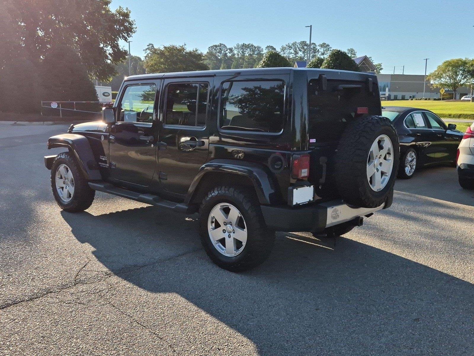 Used 2011 Black Clear Coat Jeep Sahara image 3