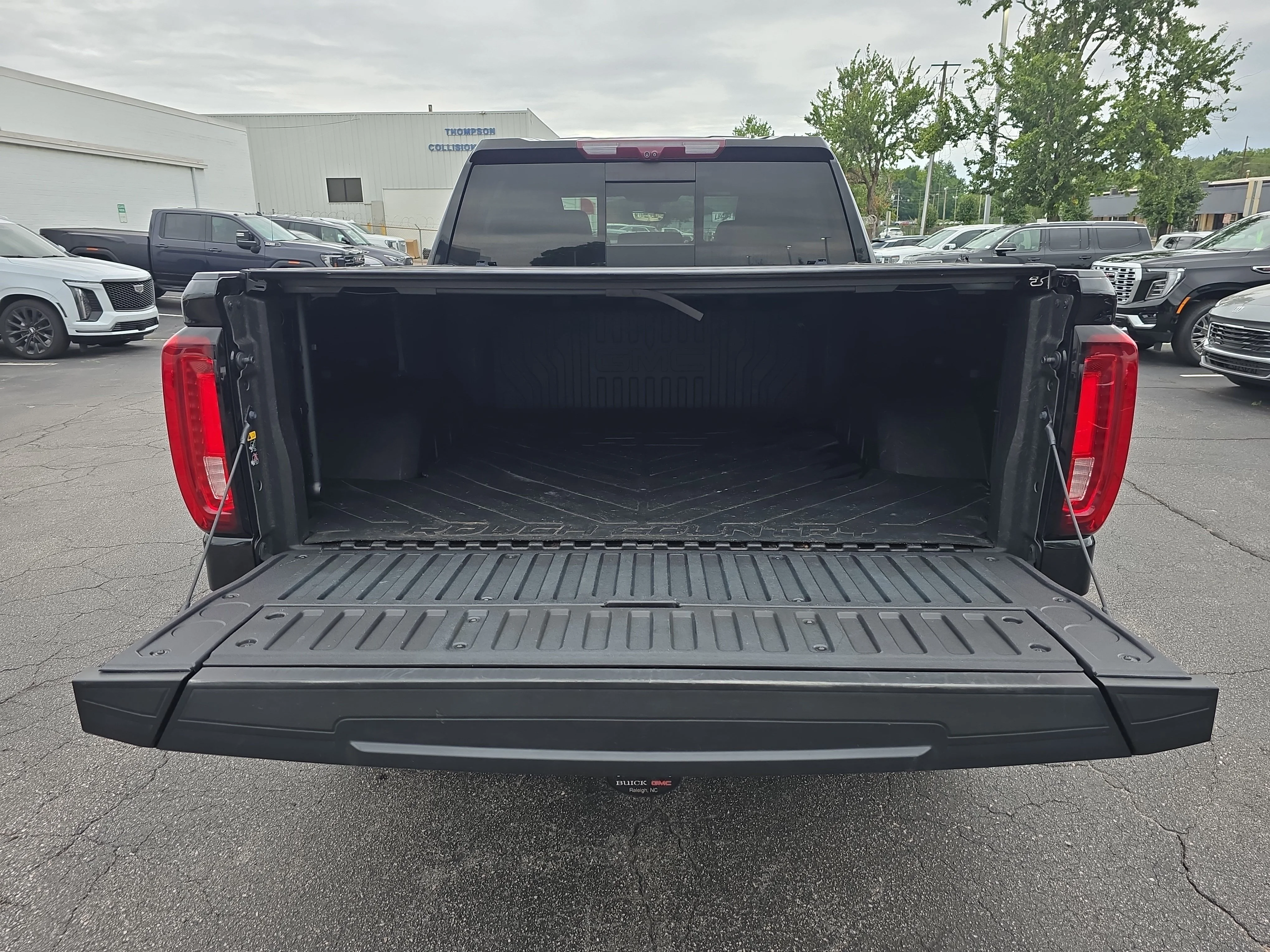 Used 2021 EBONY TWILIGHT METALLIC GMC AT4 image 13