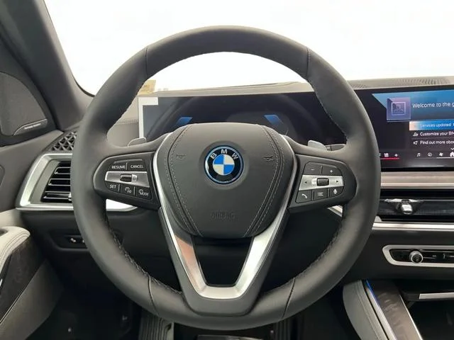 New 2026 Tanzanite Blue II Metallic BMW xDrive50e image 17