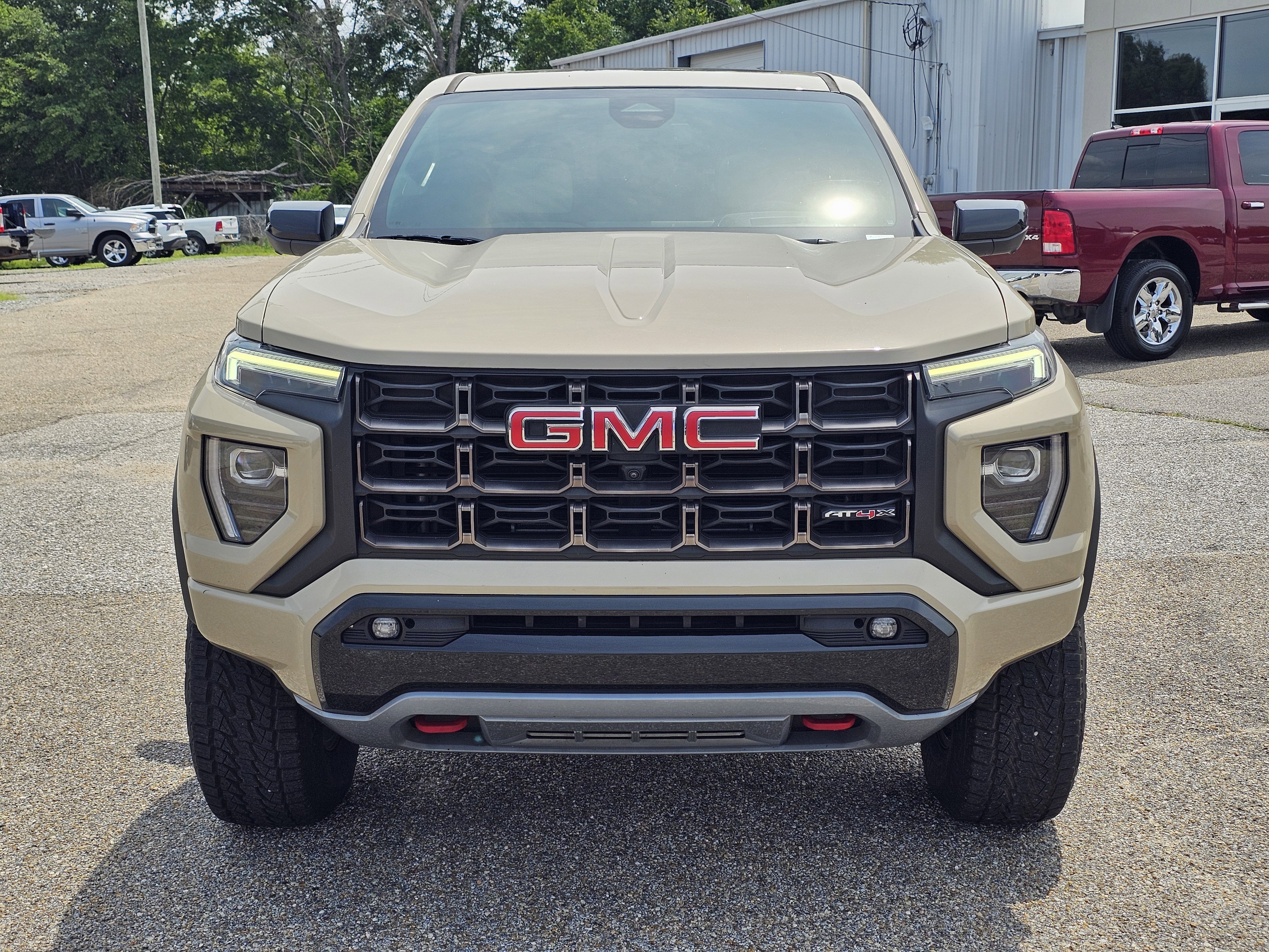 Used 2023 Desert Sand Metallic GMC 4WD AT4X image 2