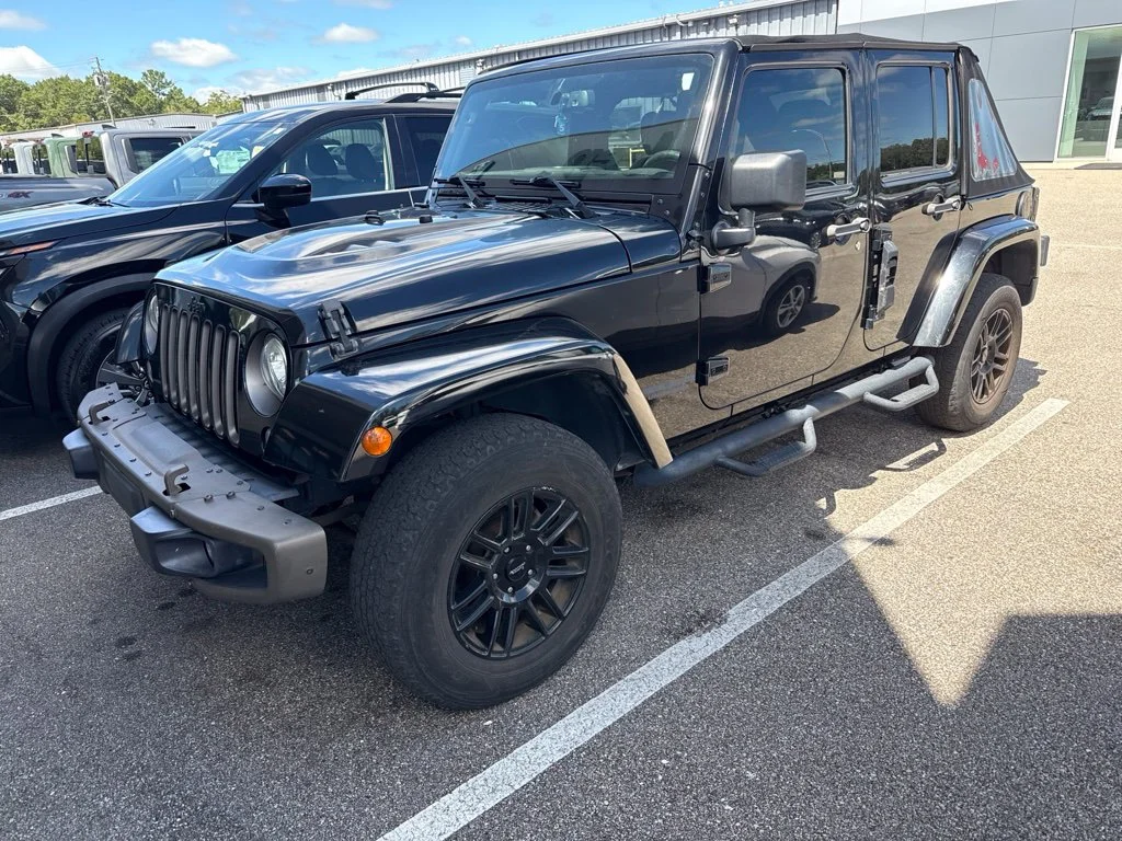 Used 2017 Black Jeep Unlimited Sahara image 1