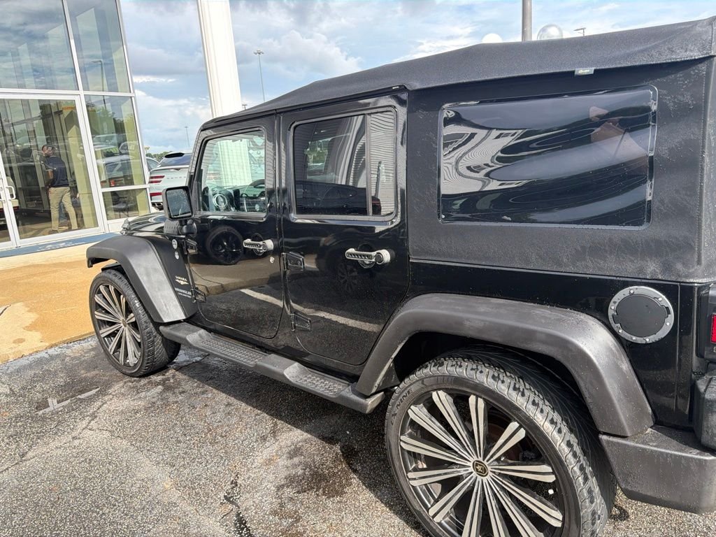 Used 2013 Black Jeep Unlimited Sahara image 3