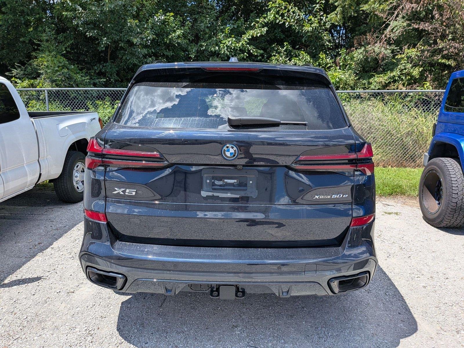 Used 2024 Carbon Black Metallic BMW xDrive50e image 4