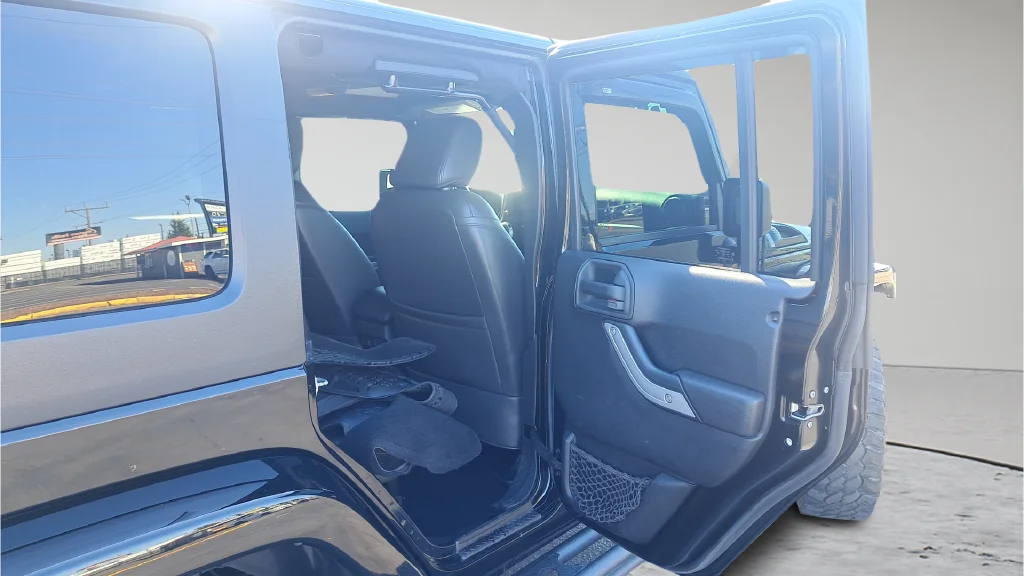 Used 2015 Black Jeep Unlimited Sahara image 12
