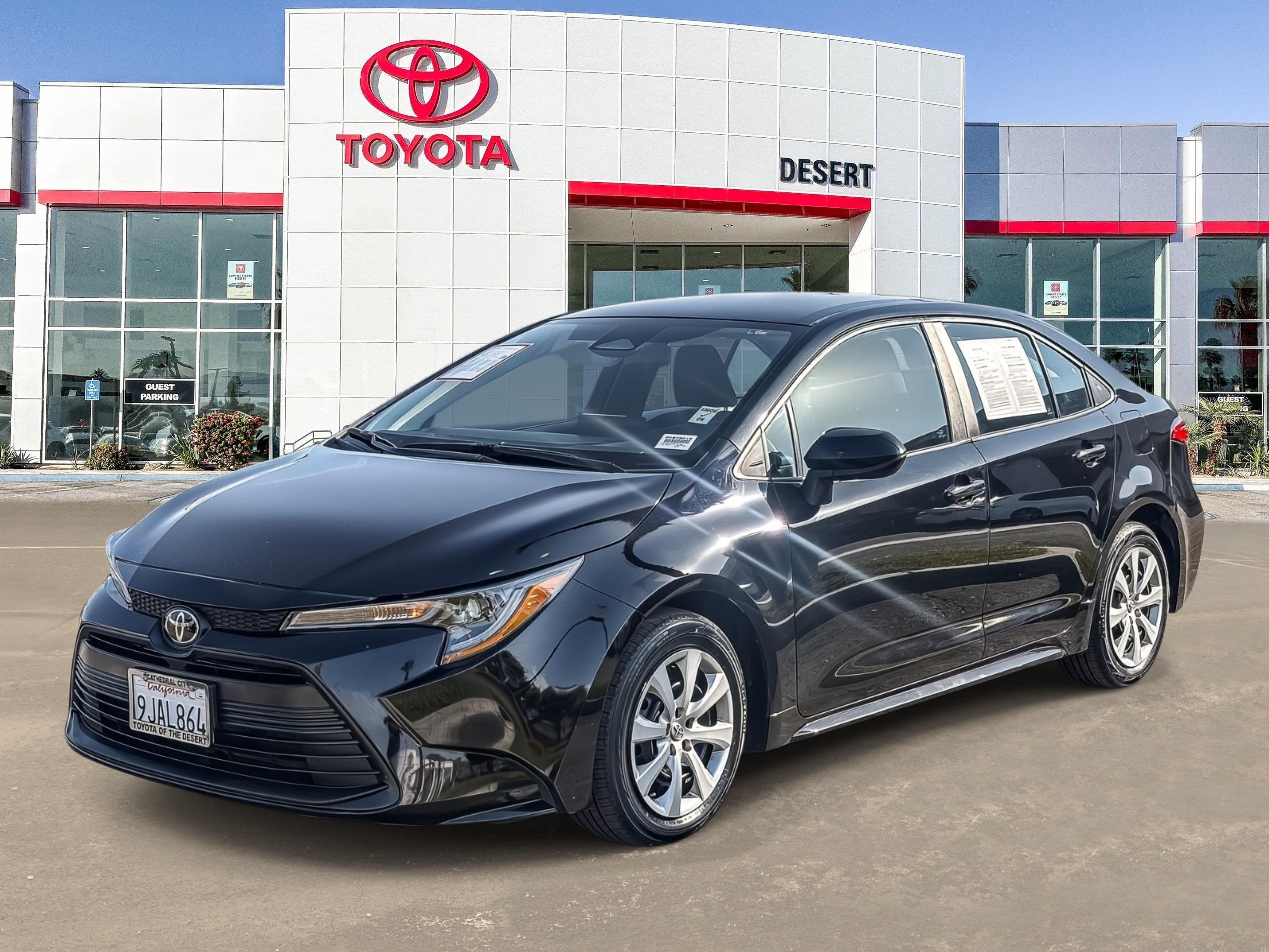 Certified Used 2024 Midnight Black Metallic Toyota LE image 1