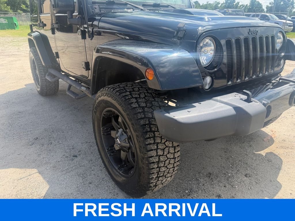 Used 2015 Black Jeep Unlimited Sahara Altitude image 4