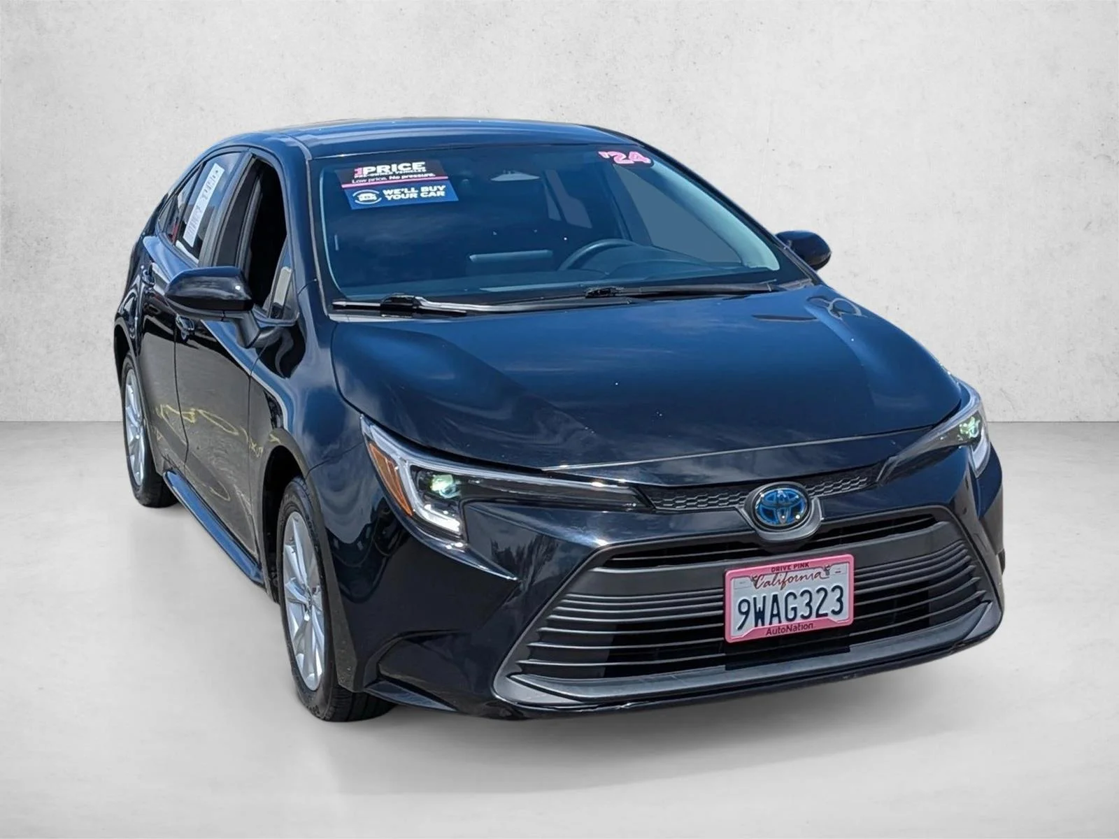 Used 2024 Midnight Black Metallic Toyota Hybrid LE image 3