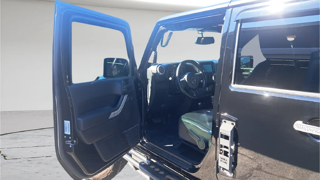 Used 2015 Black Jeep Unlimited Sahara image 8