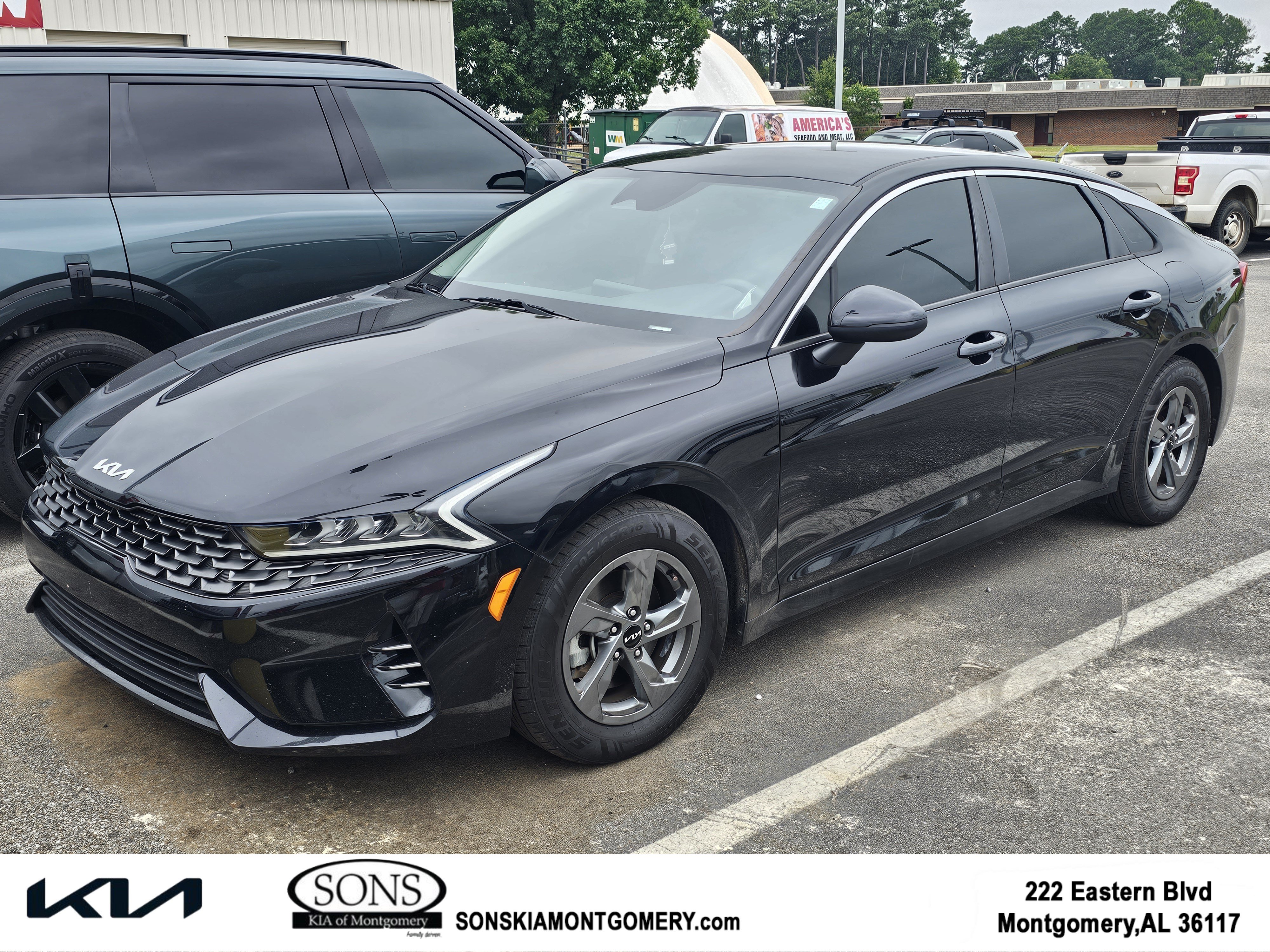 Used 2022 Ebony Black Kia LXS image 1