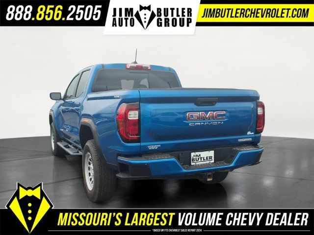 Used 2023 DYNAMIC BLUE METALLIC GMC 4WD Elevation image 3