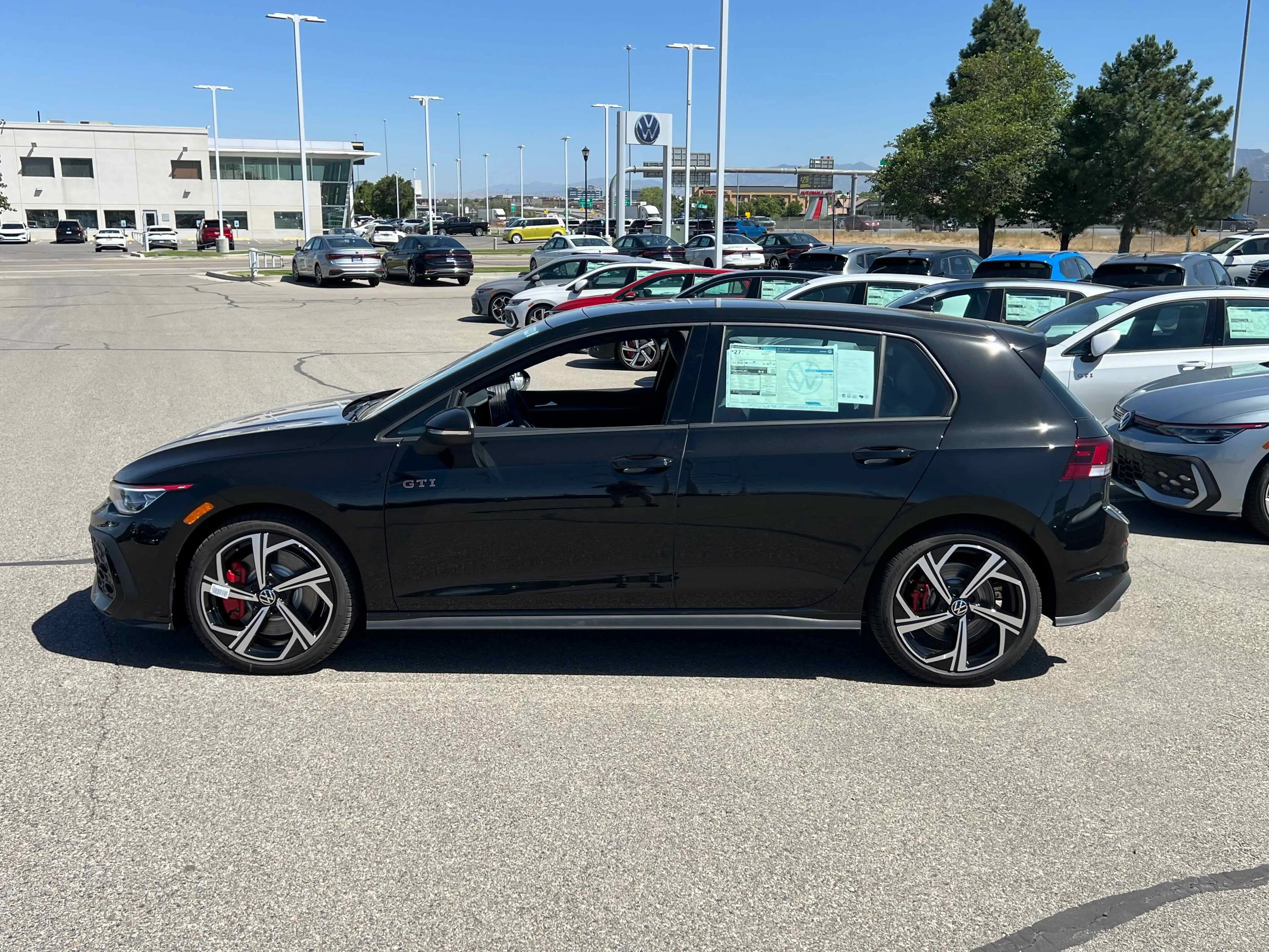 New 2025 Black Volkswagen SE image 2
