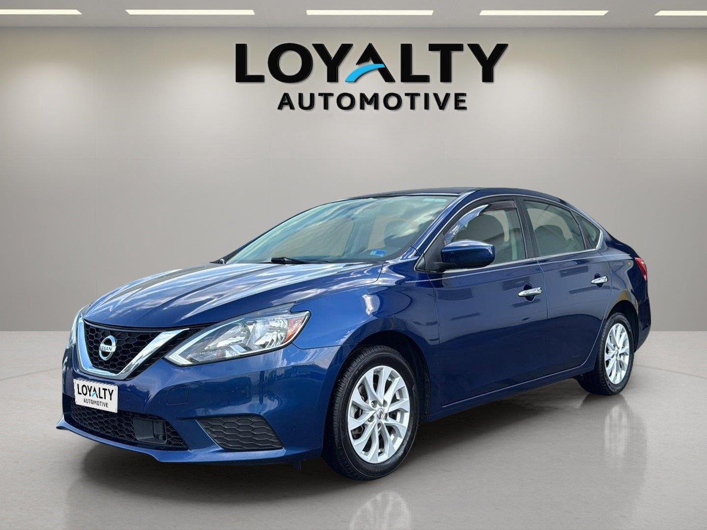 Used 2019 Deep Blue Pearl Nissan SV image 1