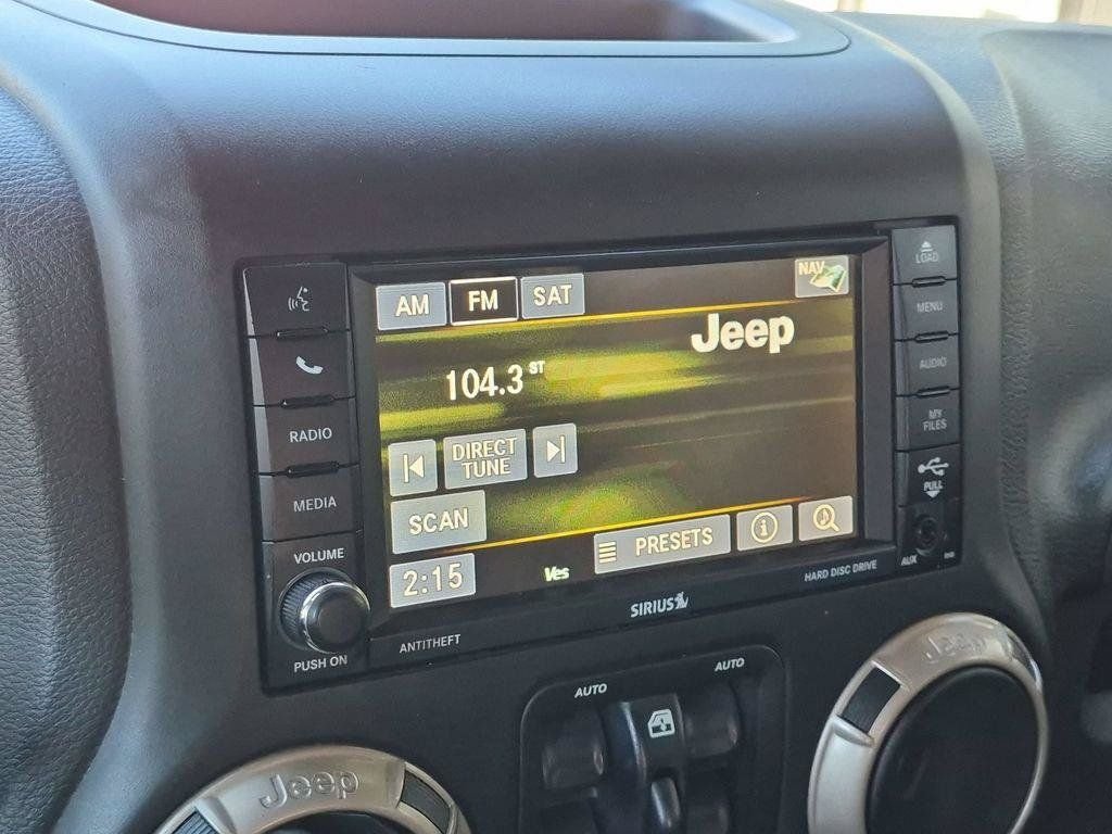 Used 2016 White Jeep Unlimited Sahara image 14