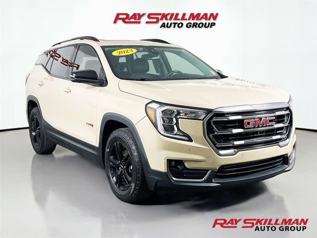Used 2023 Desert Sand Metallic GMC AT4 image 1