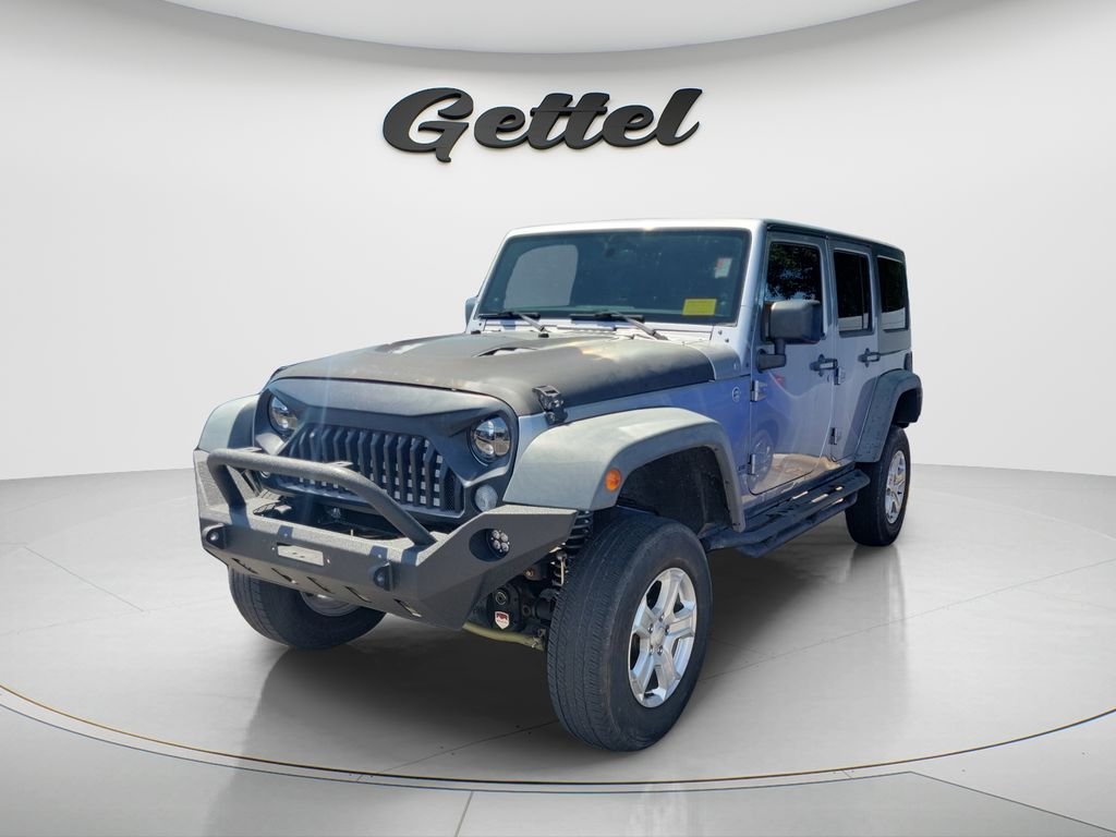 Used 2014 Jeep Wrangler Unlimited Sport with VIN 1C4BJWDG3EL228256 for sale in Bradenton, FL