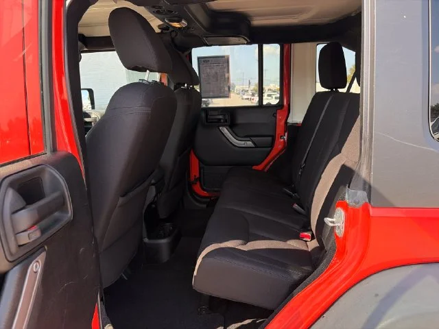 Used 2015 Orange Jeep Unlimited Sport image 22