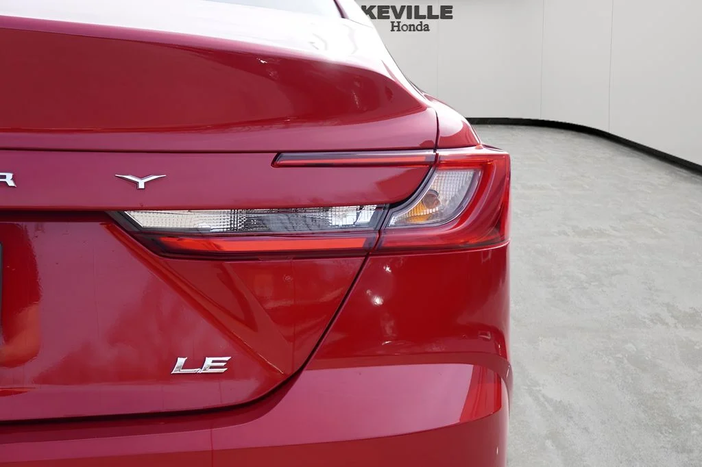 Used 2025 Supersonic Red Toyota LE image 7