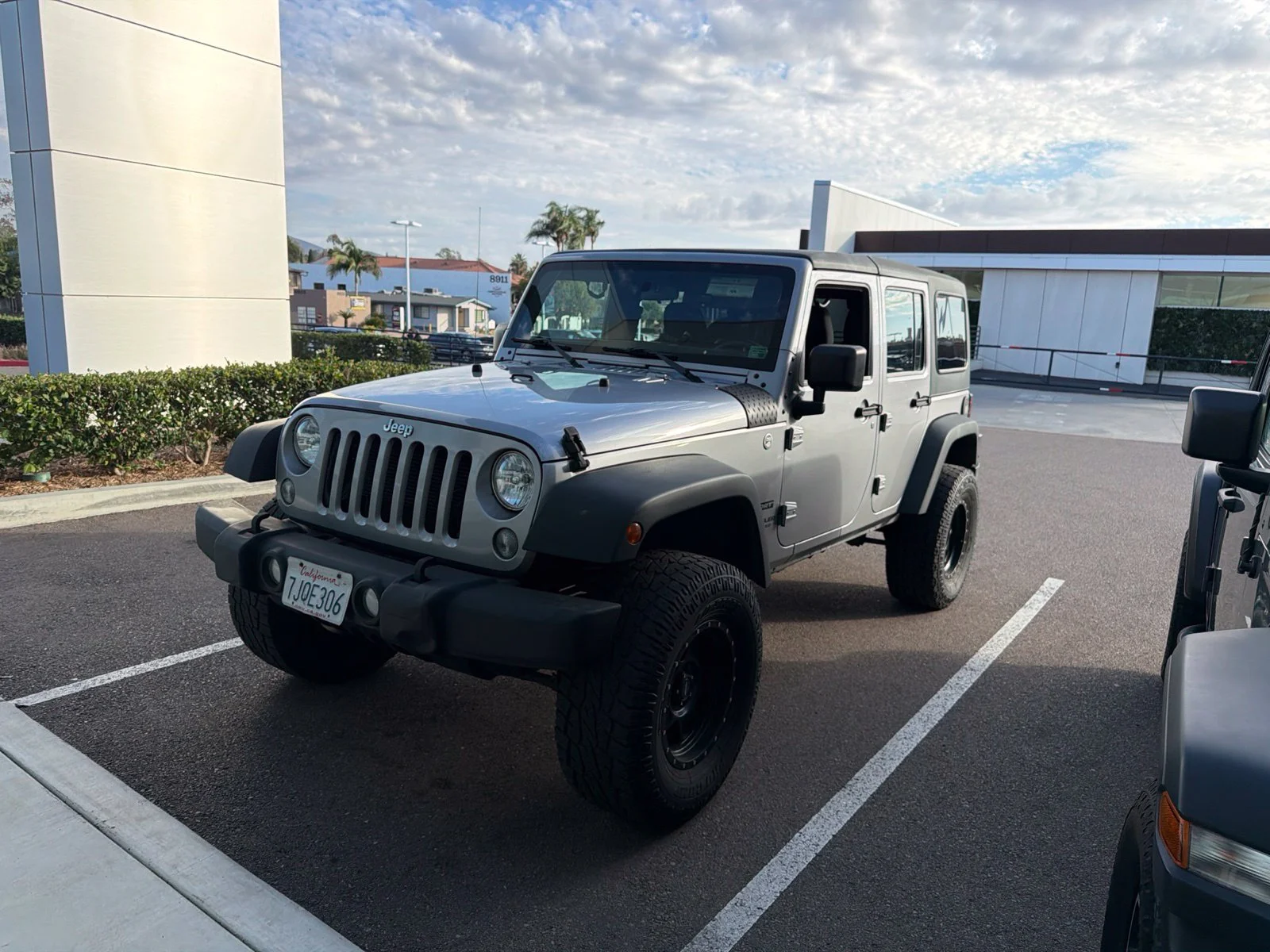 Used 2015 Silver Jeep Unlimited Sport image 1