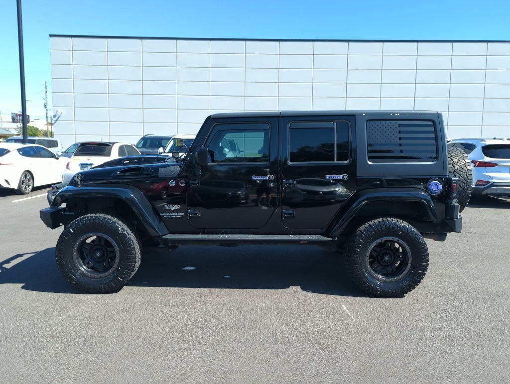 Used 2015 Black Jeep Unlimited Sahara image 4