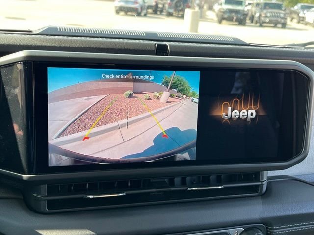 Used 2025 Bright White Clearcoat Jeep Sahara 4xe image 16