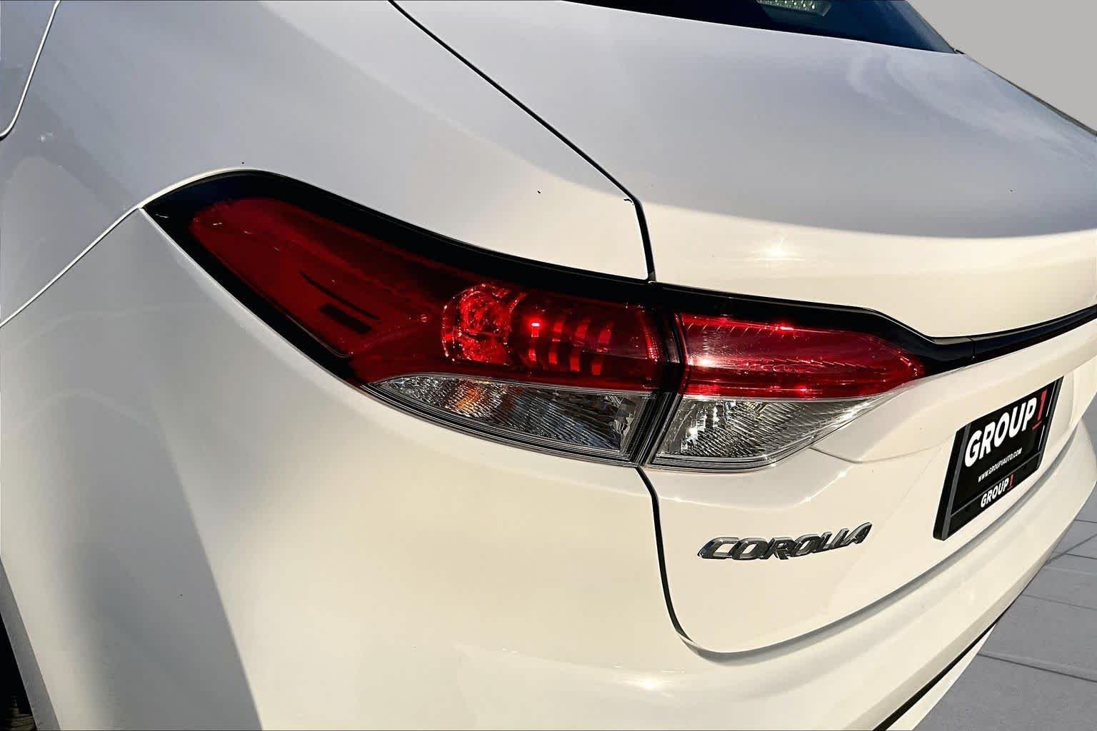 Used 2021 Super White Toyota LE image 29