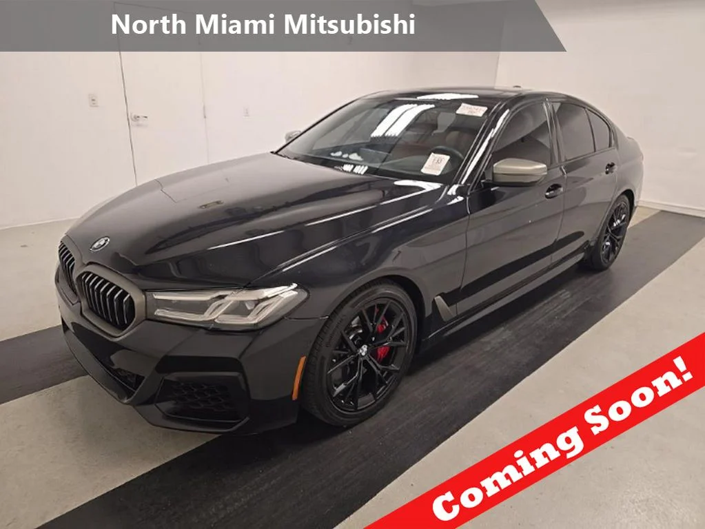 Used 2021 Black BMW M550i xDrive image 1