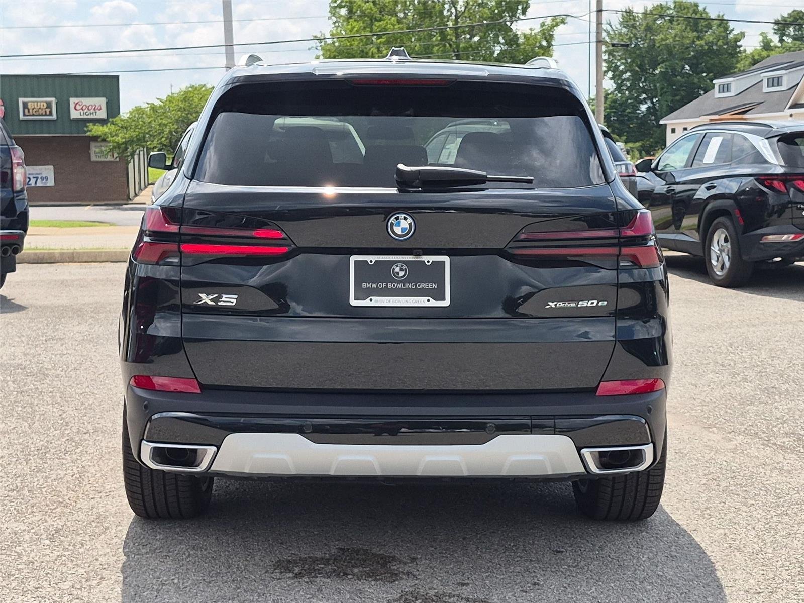 New 2026 Black Sapphire Metallic BMW xDrive50e image 4