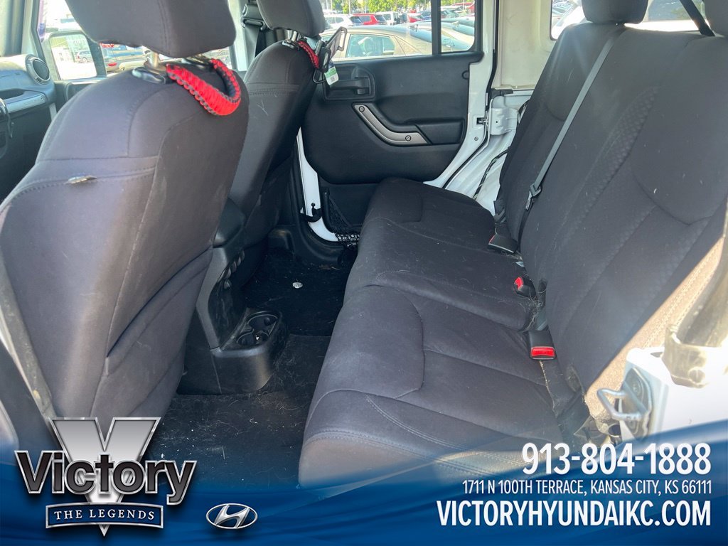 Used 2013 White Jeep Unlimited Sport image 10