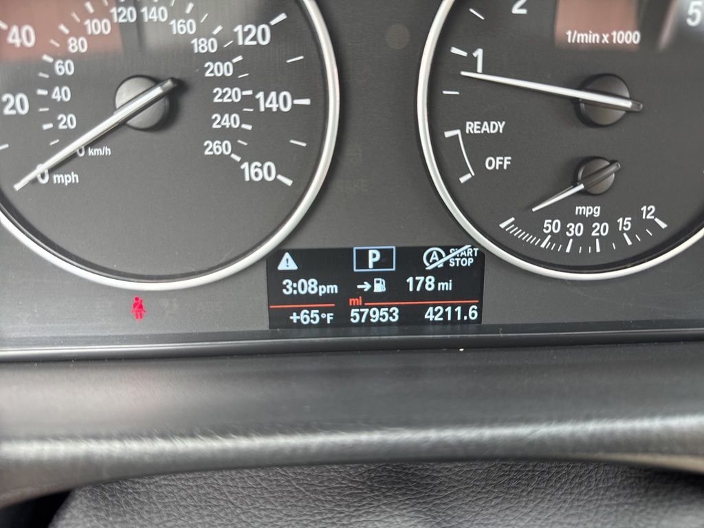 Used 2018 Black Sapphire Metallic BMW 320i xDrive image 16