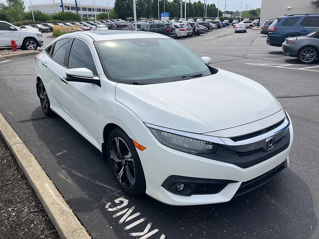 Used 2017 White Orchid Pearl Honda Touring image 1