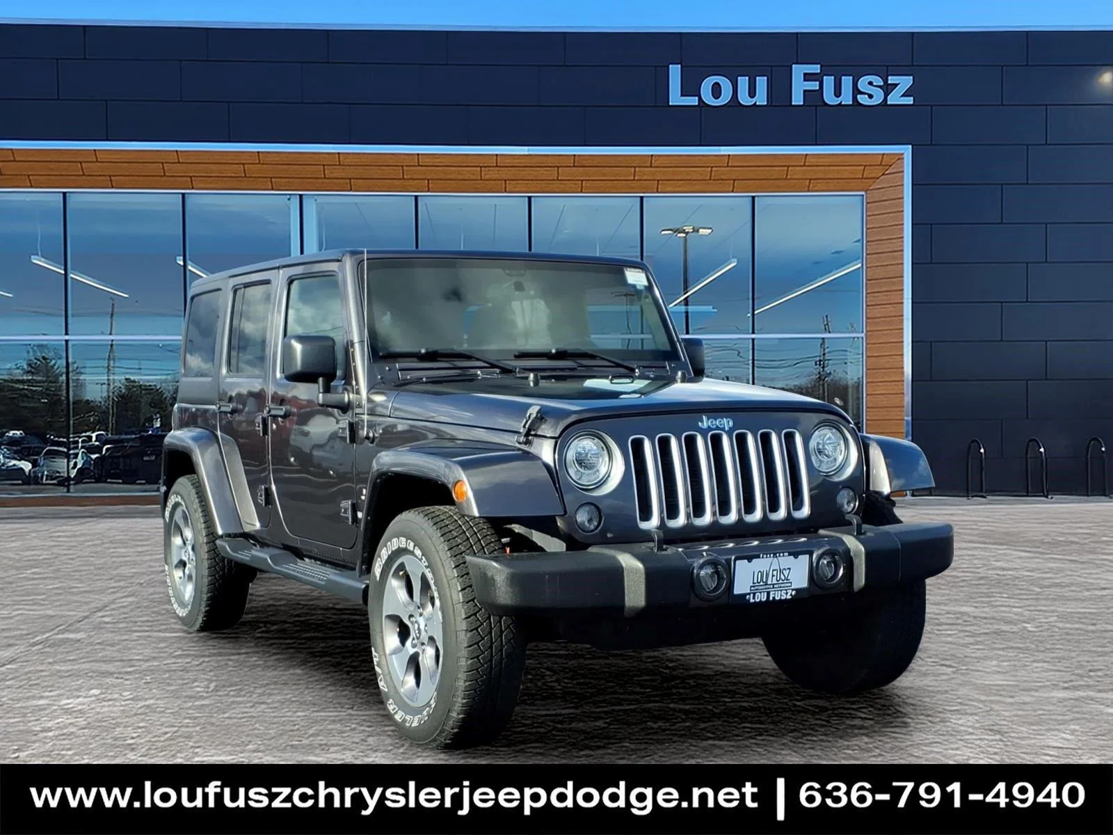 Used 2017 Granite Crystal Metallic Clearcoat Jeep Sahara image 1