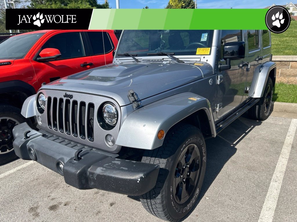 Used 2015 Silver Jeep Unlimited Sahara image 1