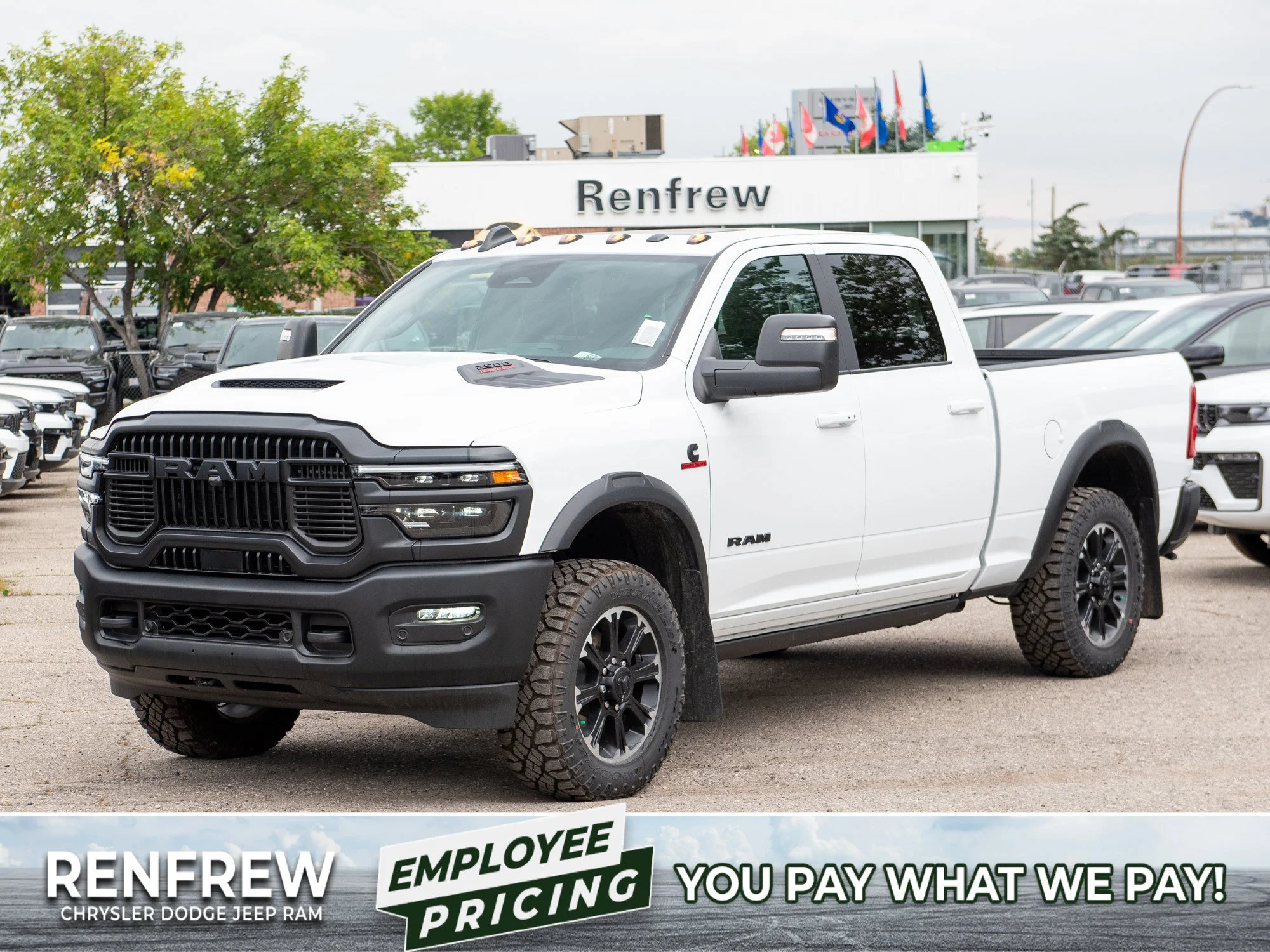 New 2026 White RAM Rebel* Crew Cab 4x4, 6.7L Cummins, Sunroof, 34 Inch A/T Tires, Passenger Screen image 1