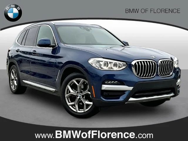 Used 2021 Blue BMW sDrive30i image 1