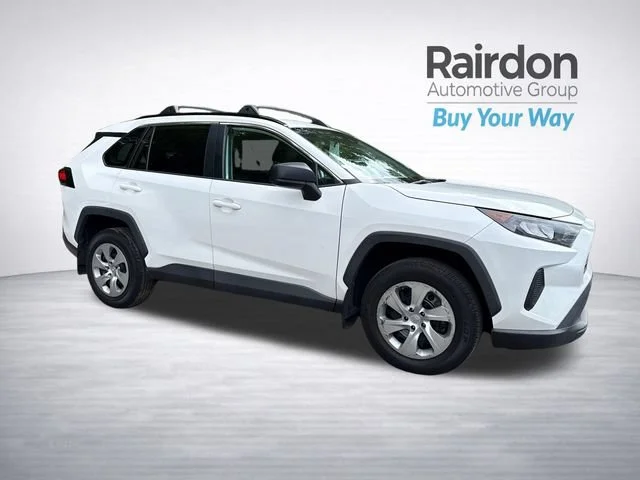 Used 2021 Super White Toyota LE image 1