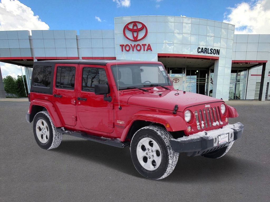 Used 2014 Jeep Wrangler Unlimited Sahara with VIN 1C4BJWEG1EL129465 for sale in Minneapolis, Minnesota