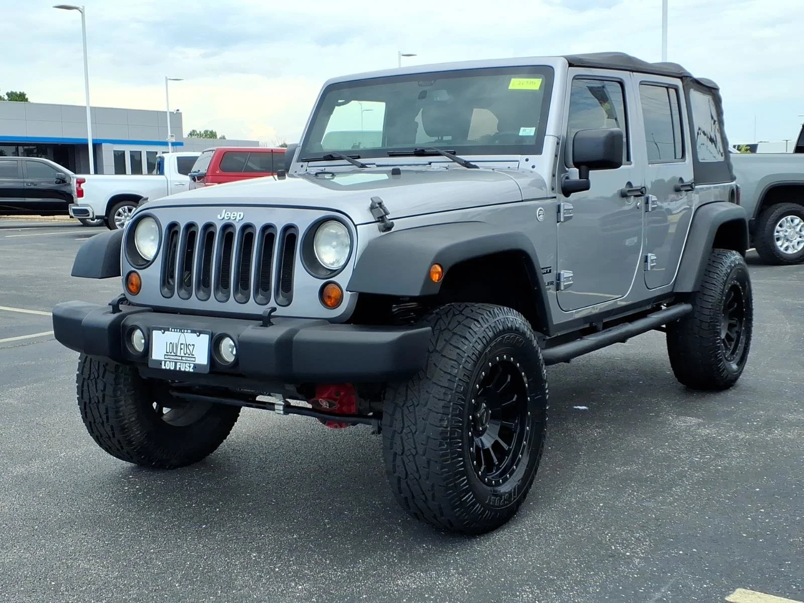 Used 2013 Billet Silver Metallic Jeep Sport image 2