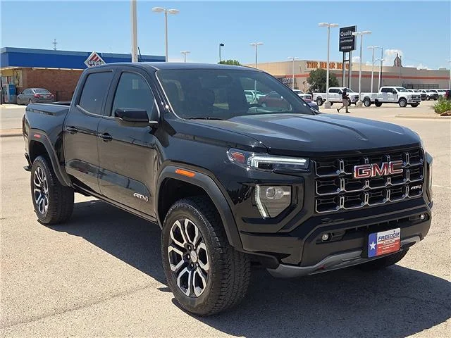 Used 2024 Onyx Black GMC AT4 4x4 Crew Cab 5 ft. box 131 in. WB image 5