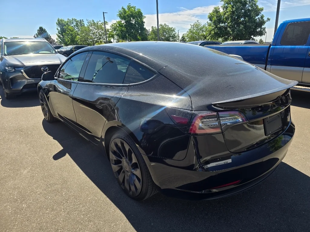 Used 2022 Solid Black Tesla Performance image 13