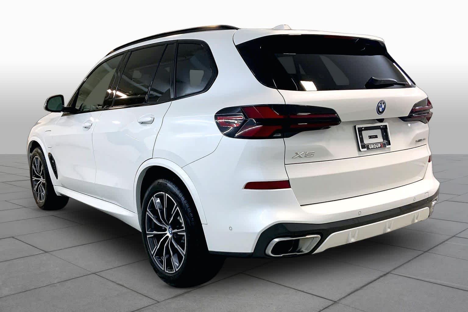 Used 2024 Mineral White Metallic BMW xDrive50e image 11