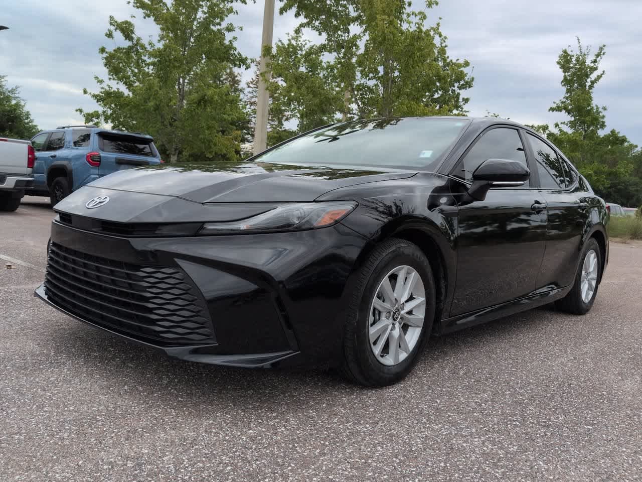 Used 2025 Midnight Black Metallic Toyota LE image 2