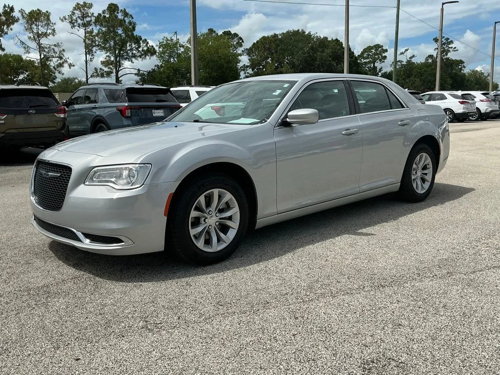 Used 2023 Silver Chrysler Touring image 1