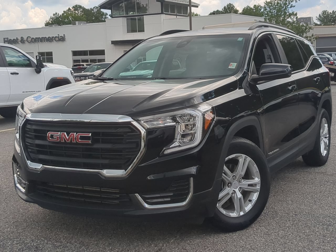 Used 2023 Ebony Twilight Metallic GMC SLE image 1