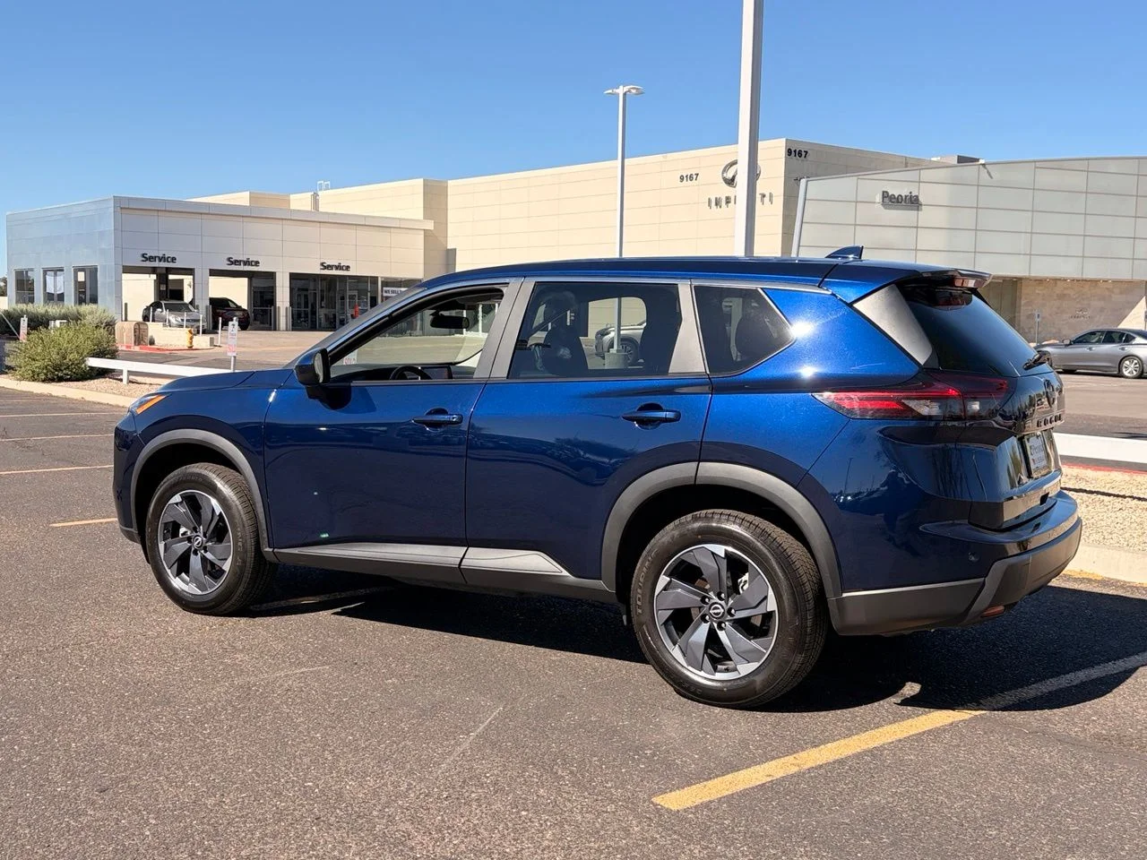 Used 2025 Deep Ocean Blue Pearl Nissan SV image 3